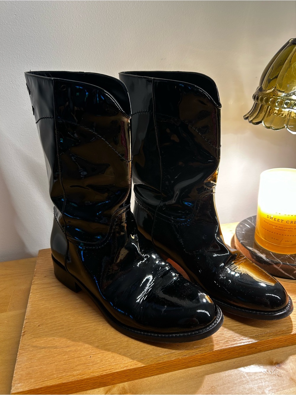 CHANEL women’s black leather boots